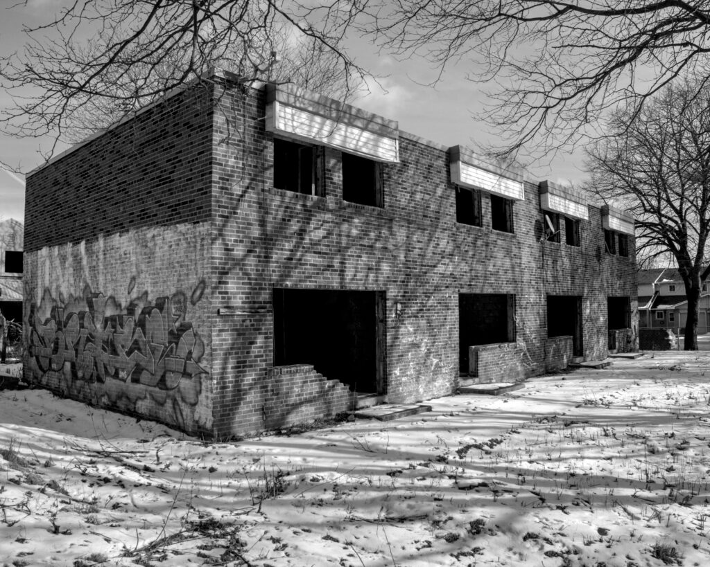 black and white photo of abandoned townhouse block